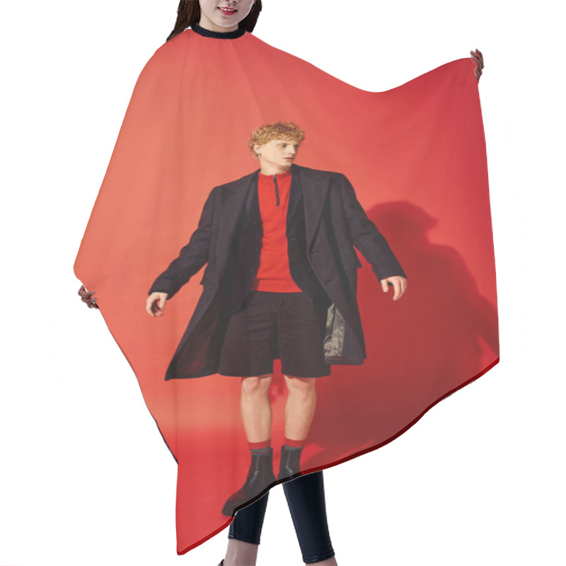 Personality  Standing Against A Vibrant Red Backdrop, A Man Showcases Contemporary Holiday Fashion With A Layered Look. Hair Cutting Cape