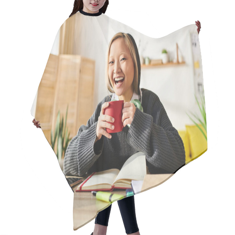 Personality  A Young Asian Woman Focusing On Her Studies, Holding A Vibrant Red Cup While Sitting At A Desk With A Laptop. Hair Cutting Cape