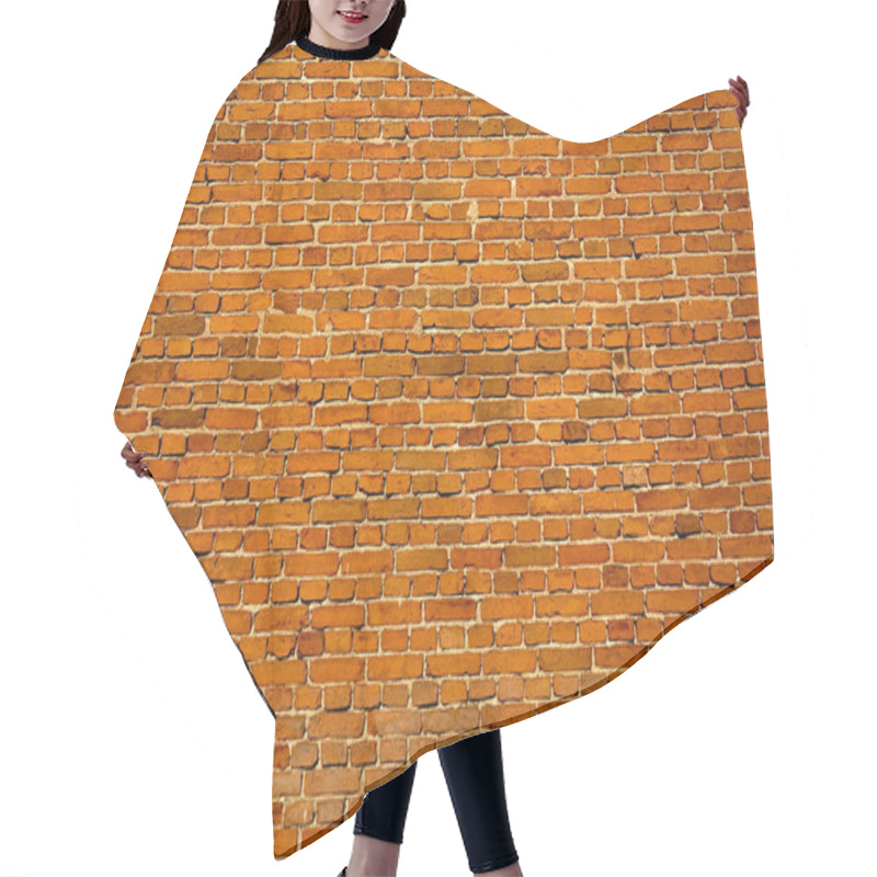 Personality  Textured Brick Wall Showcasing Warm Orange Hues And Rustic Charm. Hair Cutting Cape