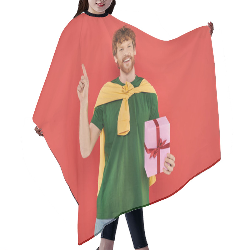 Personality  Celebration, Happy Redhead Man With Beard Posing In Casual Attire On Coral Background, Holding Gift Box, Festive Occasions, Present, Fashion And Trend, Happiness, Holiday, Pointing With Finger Hair Cutting Cape