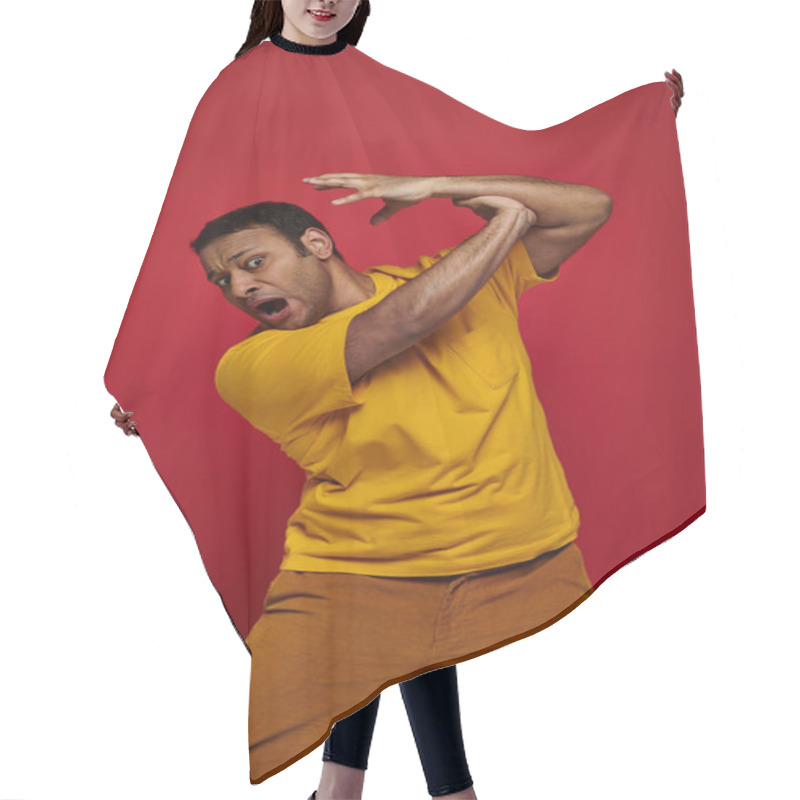 Personality  Face Expression, Hand On Scared Indian Man In Yellow T-shirt Attacking Him On Red Background Hair Cutting Cape