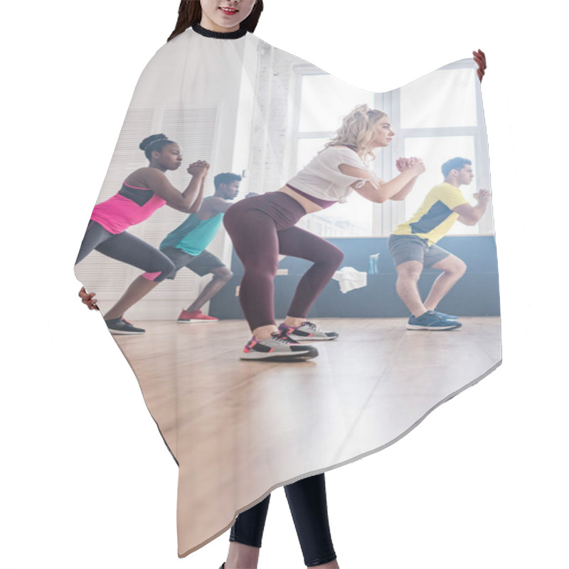 Personality  Low Angle View Of Multiethnic Zumba Dancers Stretching While Training In Dance Studio Hair Cutting Cape