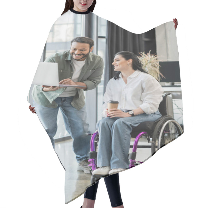 Personality  Cheerful Indian Businessman Showing Startup Project On Laptop To Disabled Woman In Wheelchair Hair Cutting Cape