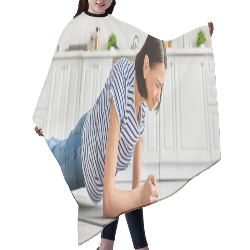 Personality  A Mature Woman In Homewear Practices Yoga On A Kitchen Mat. Hair Cutting Cape