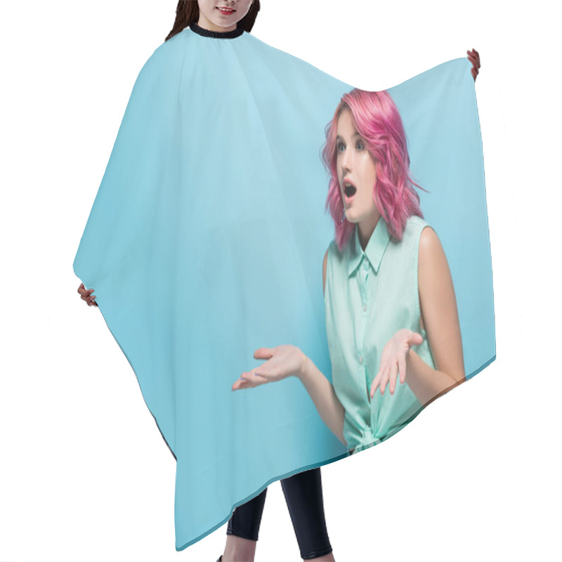 Personality  Surprised Young Woman With Pink Hair And Open Mouth Showing Shrug Gesture On Blue Background Hair Cutting Cape