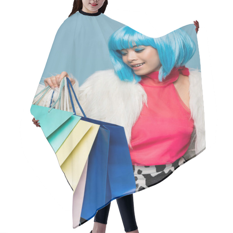 Personality  Positive Asian Model In Pop Art Style Holding Shopping Bags Isolated On Blue  Hair Cutting Cape