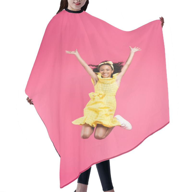 Personality  Full Length View Of Happy Curly African American Child In Yellow Outfit Jumping With Hands In Air On Pink Background Hair Cutting Cape