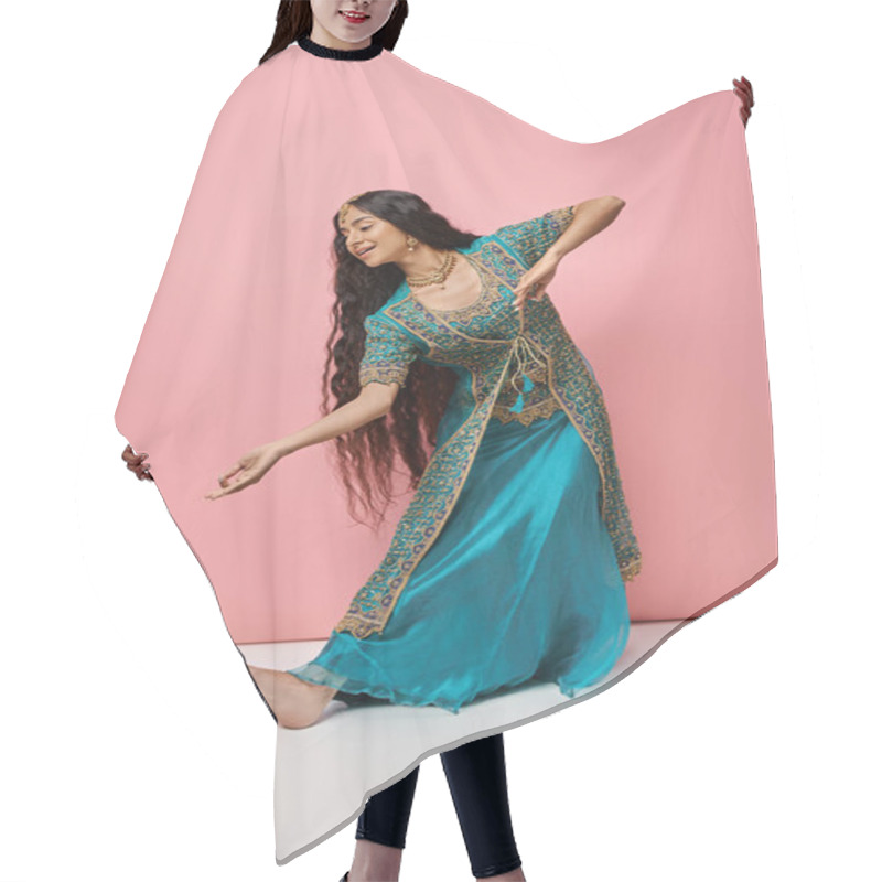 Personality  Good Looking Indian Woman In Traditional Blue Sari Gesturing While Dancing On Pink Background Hair Cutting Cape