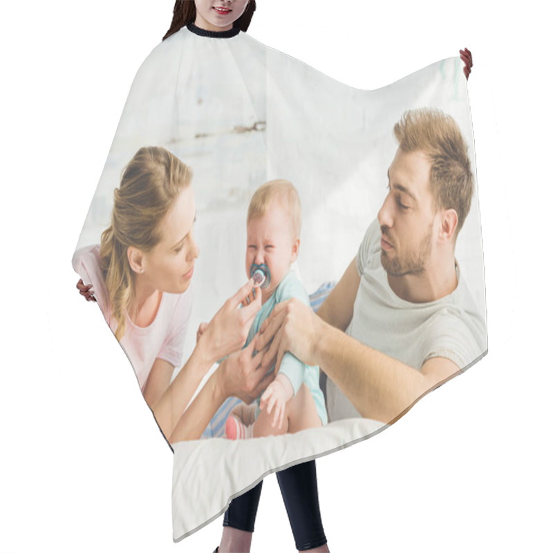 Personality  Young Parents Trying To Calm Down Crying Infant Daughter With Baby Dummy Hair Cutting Cape