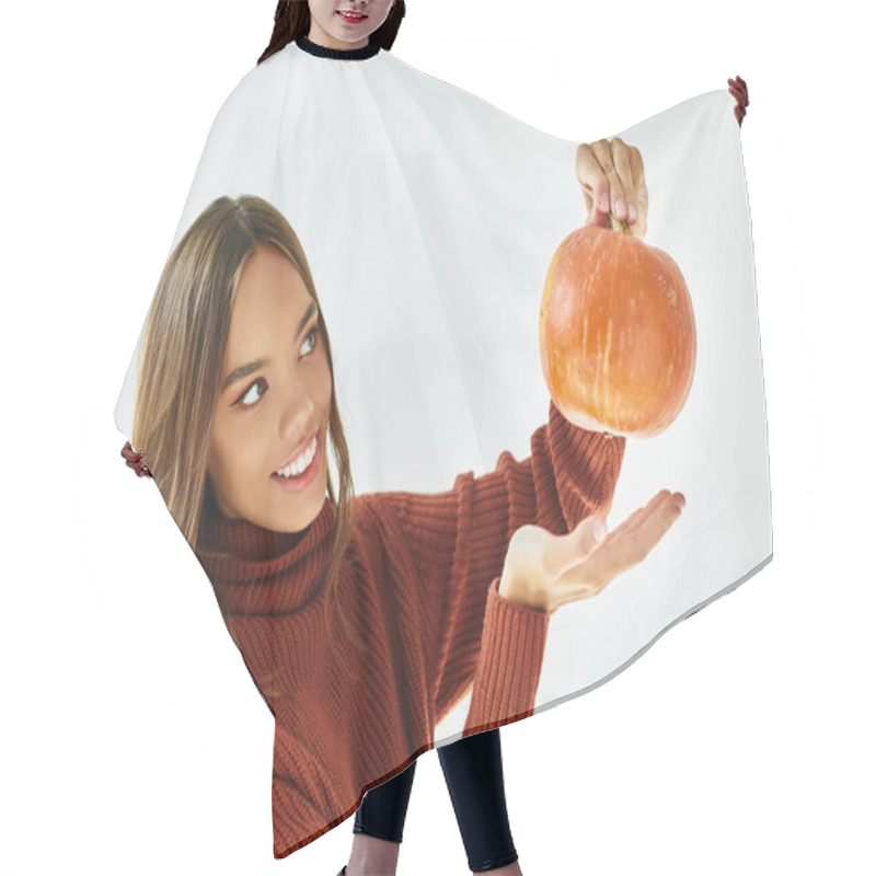 Personality  A Cheerful Woman Joyfully Holds A Small Pumpkin, Embracing The Festive Spirit Of Halloween. Hair Cutting Cape