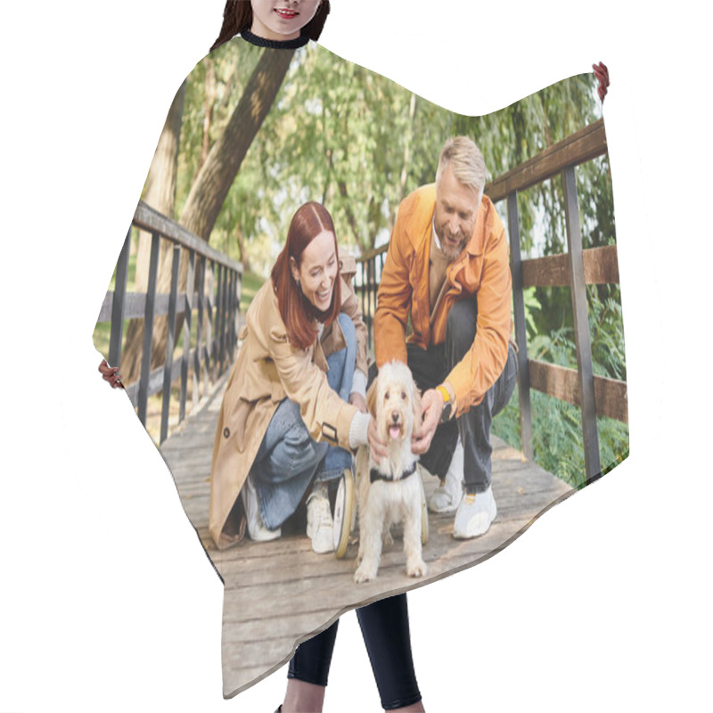 Personality  Man And Woman Lovingly Pet A Dog On A Bridge In The Park. Hair Cutting Cape