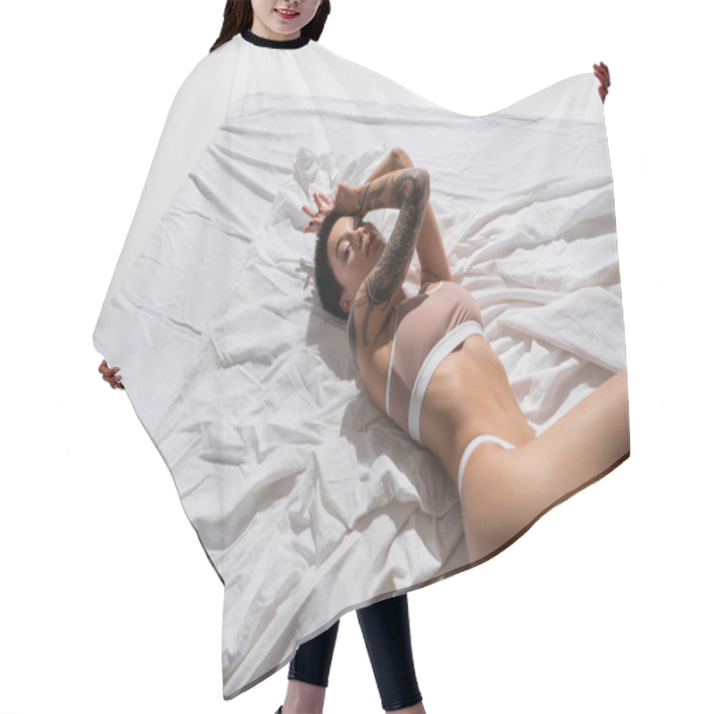 Personality  High Angle View Of Young Provocative Woman With Sexy Buttocks, Short Brunette Hair And Slender Body Looking At Camera While Laying In Beige Lingerie On White Bedding And Grey Background Hair Cutting Cape