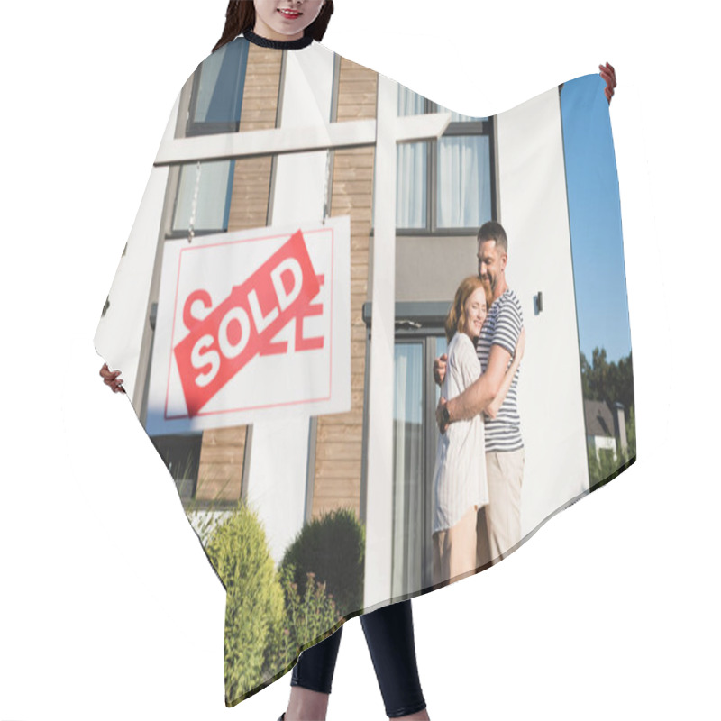 Personality  Happy Couple Embracing While Standing Near Sign With Sold Lettering On Foreground Hair Cutting Cape