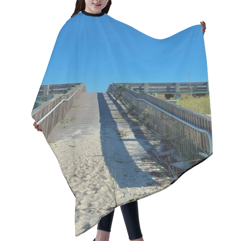 Personality  A Sunlit Wooden Boardwalk Leads Over Sandy Dunes, Framed By Railings And Casting Long Shadows. The Vibrant Blue Sky Above Creates A Mood Of Anticipation And Serenity, Inviting A Seaside Adventure. Hair Cutting Cape