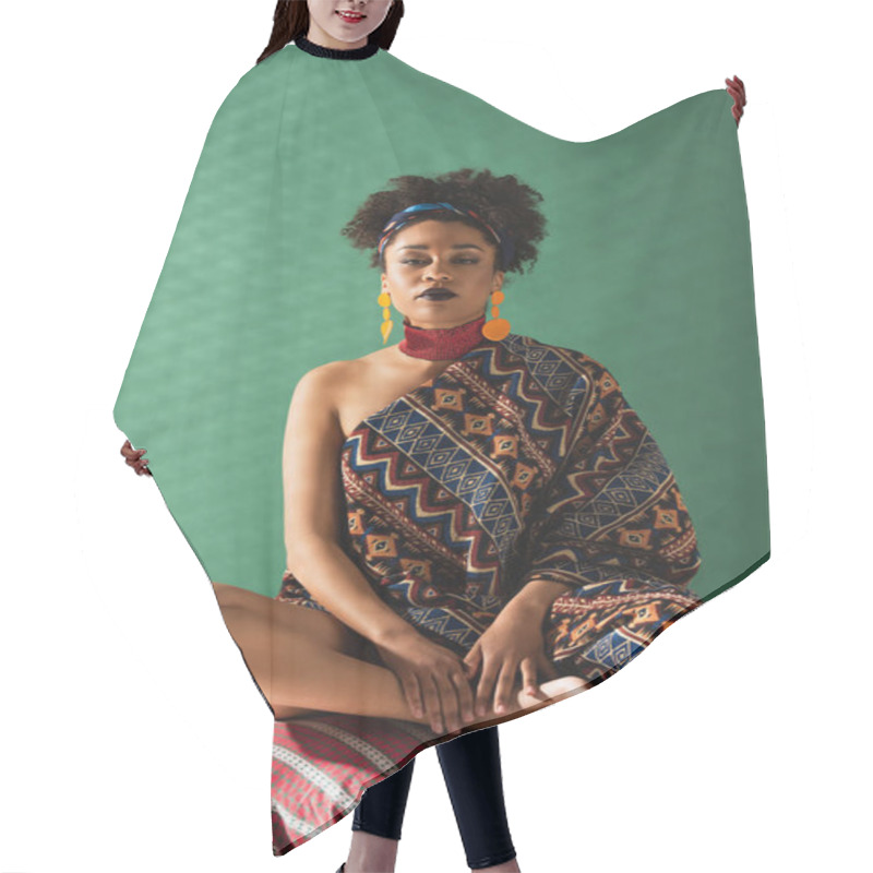 Personality  African American Woman Wrapped In Ornament Blanket Looking At Camera On Green Textured Background Hair Cutting Cape