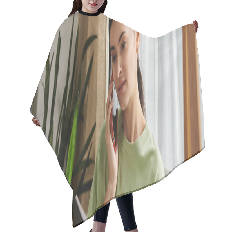 Personality  Woman Talking On Cell Phone While Holding A Book. Hair Cutting Cape