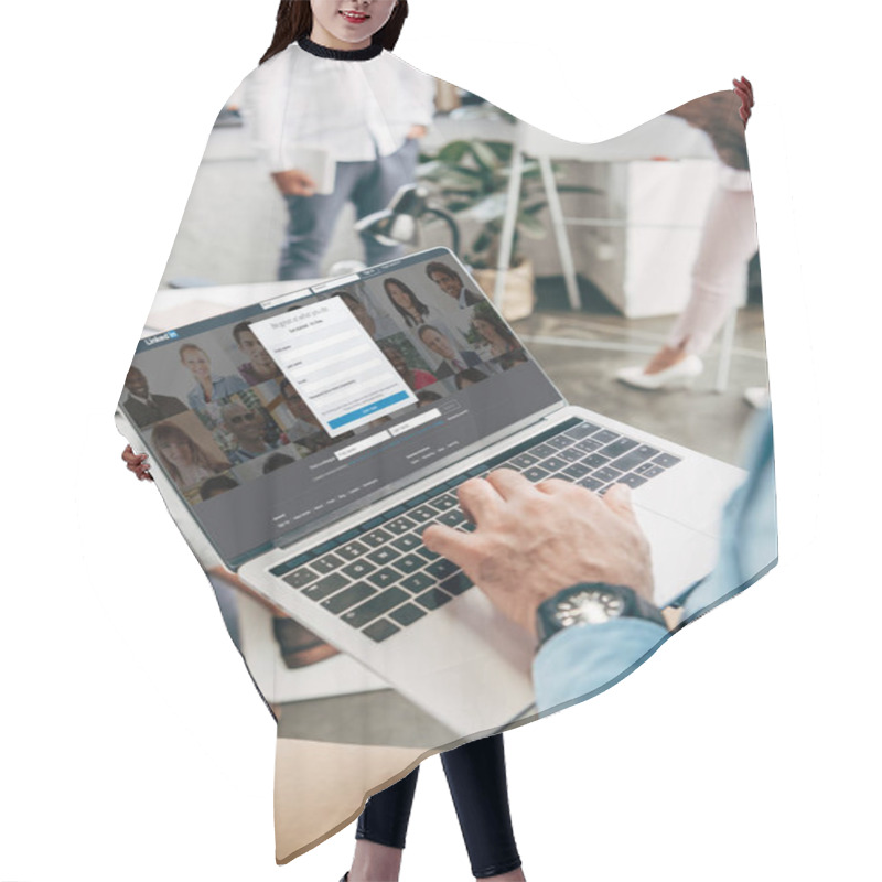 Personality  Cropped Shot Of Young Businessman Using Laptop With Linkedin Website On Screen Hair Cutting Cape