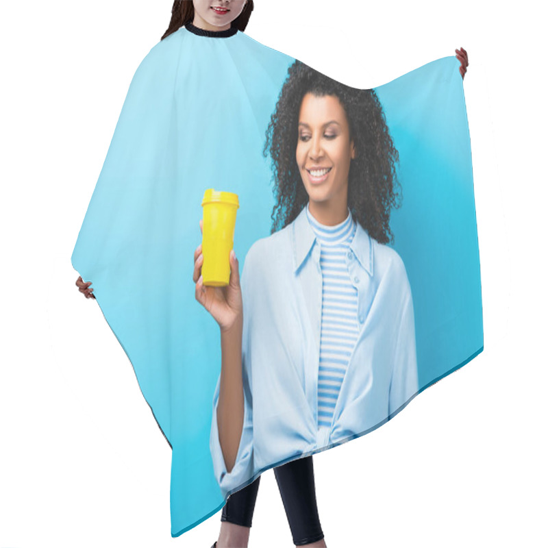 Personality  Happy African American Woman Holding Empty Reusable Mug On Blue Hair Cutting Cape