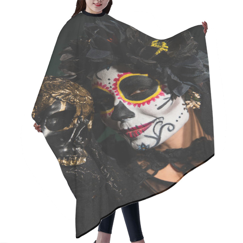 Personality  Portrait Of Woman In Halloween Catrina Makeup And Wreath Holding Skull Isolated On Black  Hair Cutting Cape