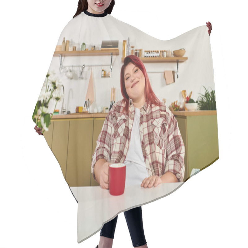 Personality  Young Plus Size Woman Enjoys Her Time In A Bright Kitchen While Sipping A Warm Drink. Hair Cutting Cape