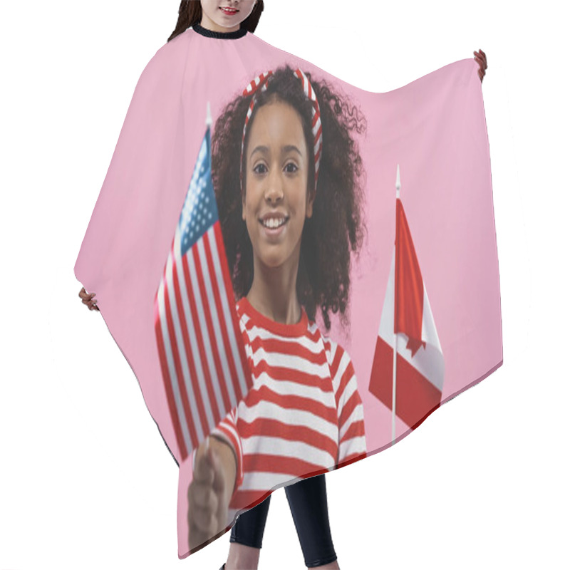 Personality  Happy African American Girl Holding Flags Of America And Canada Isolated In Pink  Hair Cutting Cape