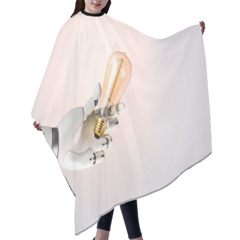 Personality  Robot Hand Holding Yellow Lamp Isolated On Beige Hair Cutting Cape