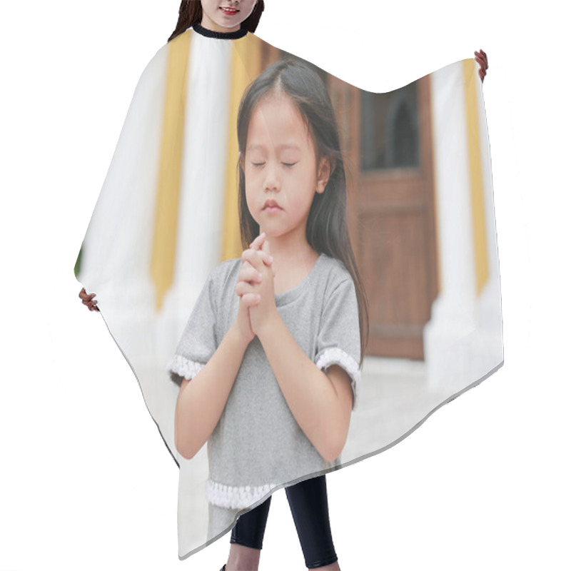 Personality  Little Asian Girl Stance Praying At The Church. Hands Folded In Prayer Concept For Faith, Spirituality And Religion. Hair Cutting Cape