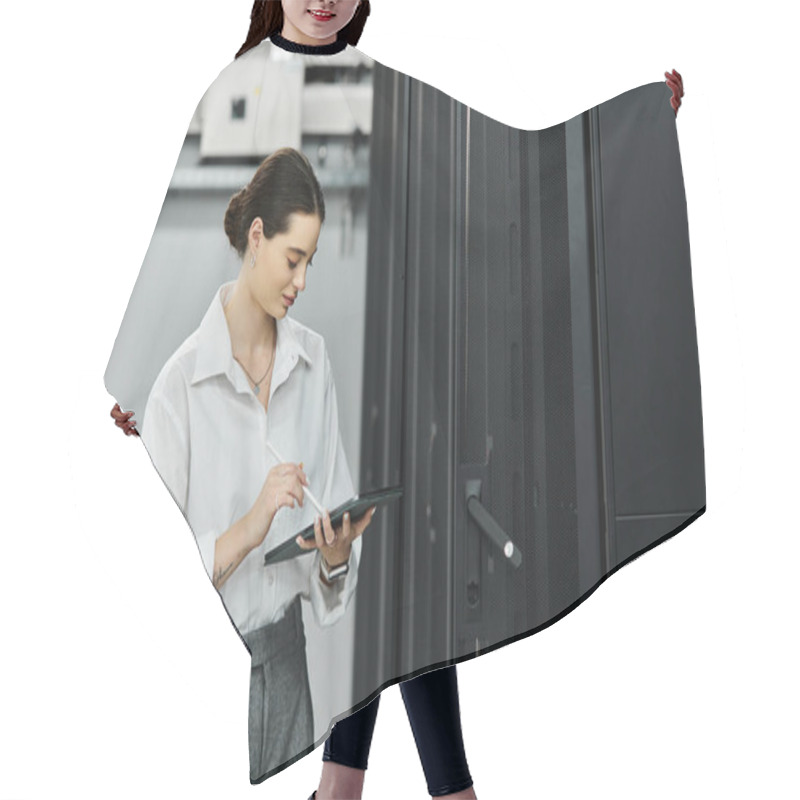 Personality  A Woman In A White Shirt Expertly Interfaces With Technology In A Data Center. Hair Cutting Cape