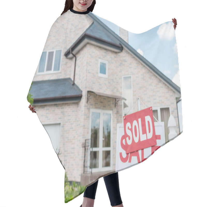 Personality  Close Up View Of Sold Sign On Wooden Placard With Sale Sign In Front Of Modern Cottage Hair Cutting Cape