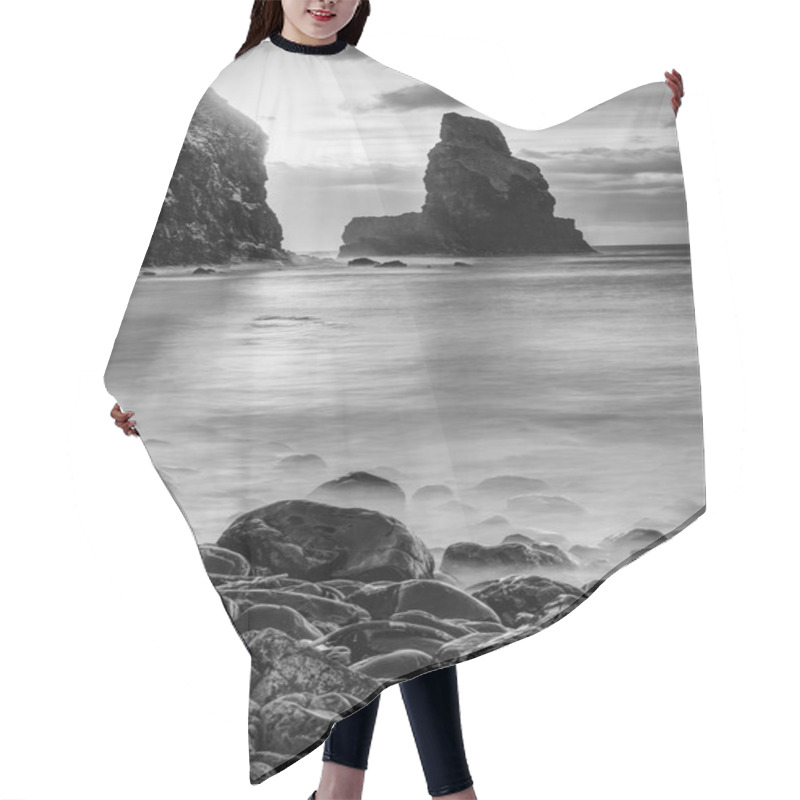 Personality  Evening Bay. Sharp Rocks, Black Rounded Boulders, Stony Beach, Sand And Dark Sky. Hair Cutting Cape