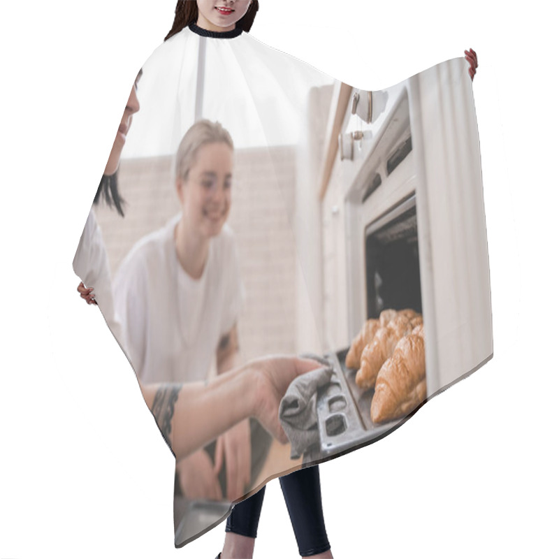 Personality  Tattooed Lesbian Couple Looking At Oven Tray With Freshly Baked Croissants In Kitchen  Hair Cutting Cape