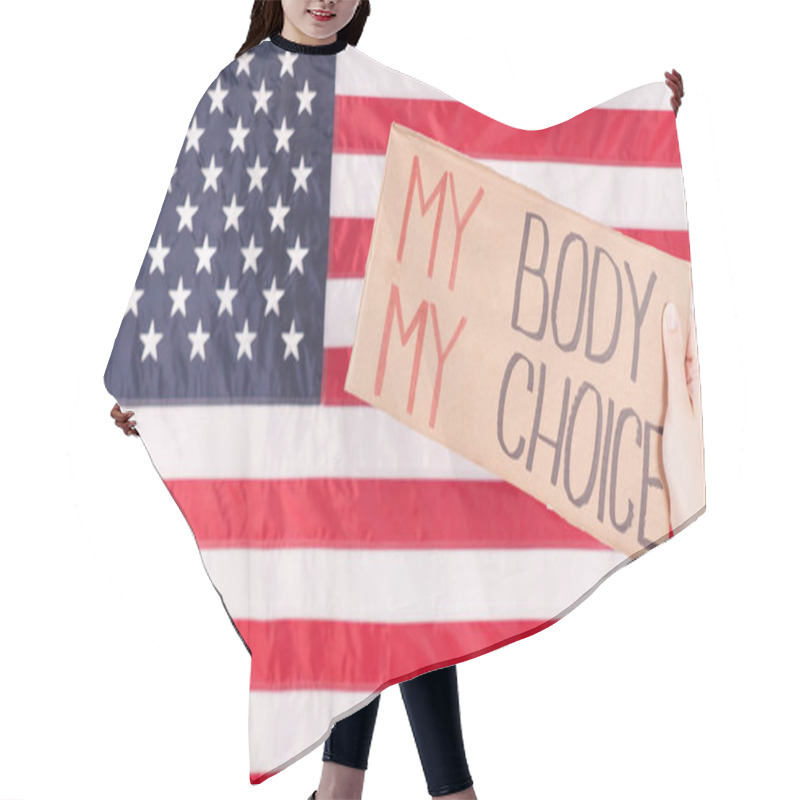 Personality  Young Woman Protester Holds Cardboard With My Body My Choice Sign Against USA Flag On Background. Girl Protesting Against Anti-abortion Laws. Feminist Power. Equal Opportunity Womens Rights Reedom Hair Cutting Cape