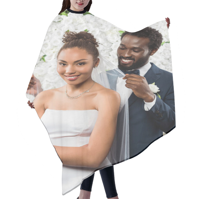 Personality  Cheerful African American Bridegroom Touching White Veil And Smiling Near Bride And Flowers  Hair Cutting Cape