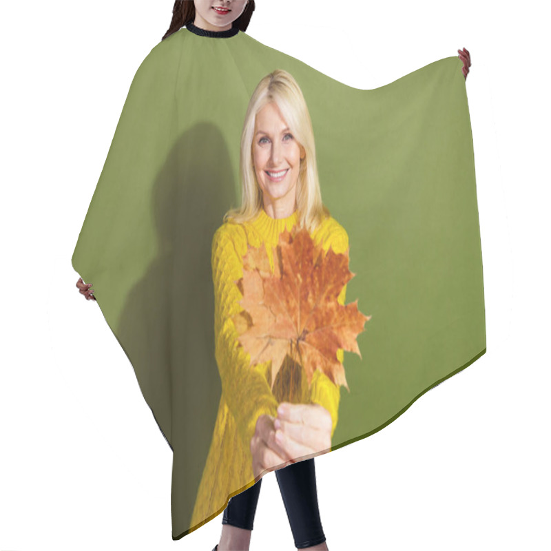 Personality  Photo Of Adorable Lovely Lady Wear Stylish Yellow Sweater Hold Dry Maple Leaves Isolated On Green Color Background. Hair Cutting Cape