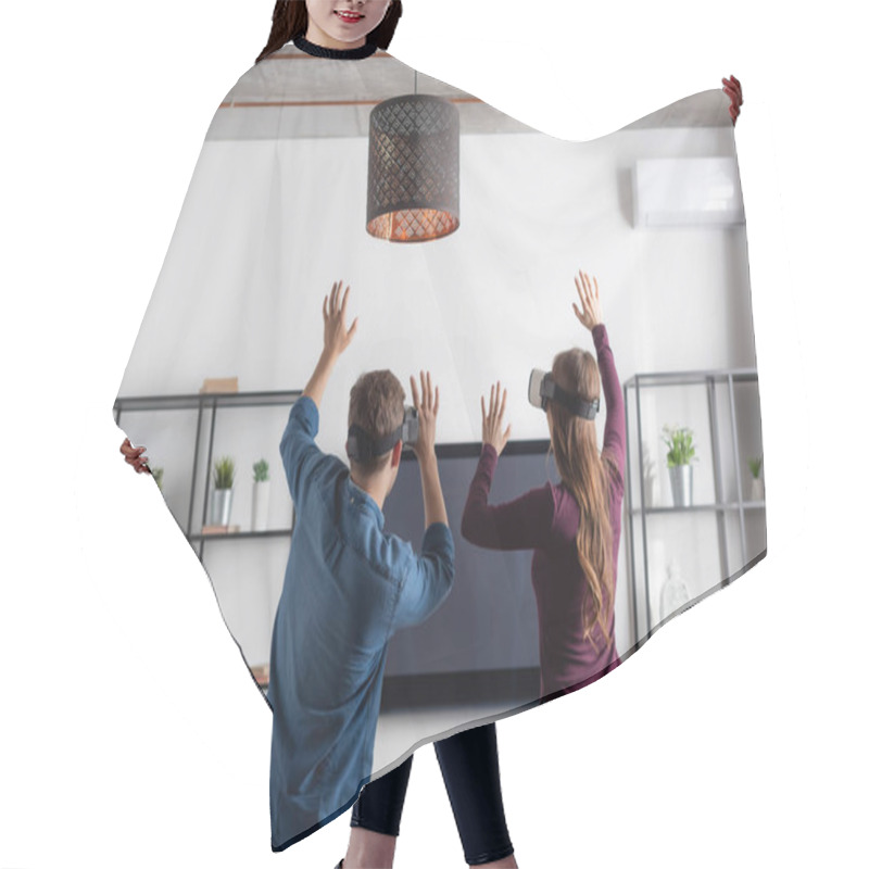 Personality  Back View Of Couple In Virtual Reality Headsets Gesturing While Gaming In Living Room  Hair Cutting Cape