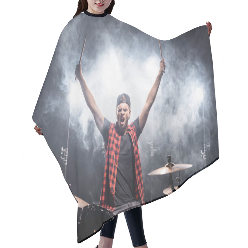 Personality  Shouting Drummer With Hands In Air Sitting At Drum Kit With Backlit And Smoke On Black  Hair Cutting Cape