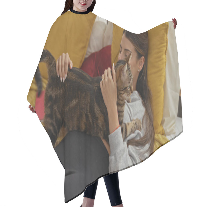 Personality  A Young Hispanic Woman Lying On A Bed In A Cozy Bedroom Cuddling A Tabby Cat, Creating A Warm And Intimate Indoor Scene At Home. Hair Cutting Cape