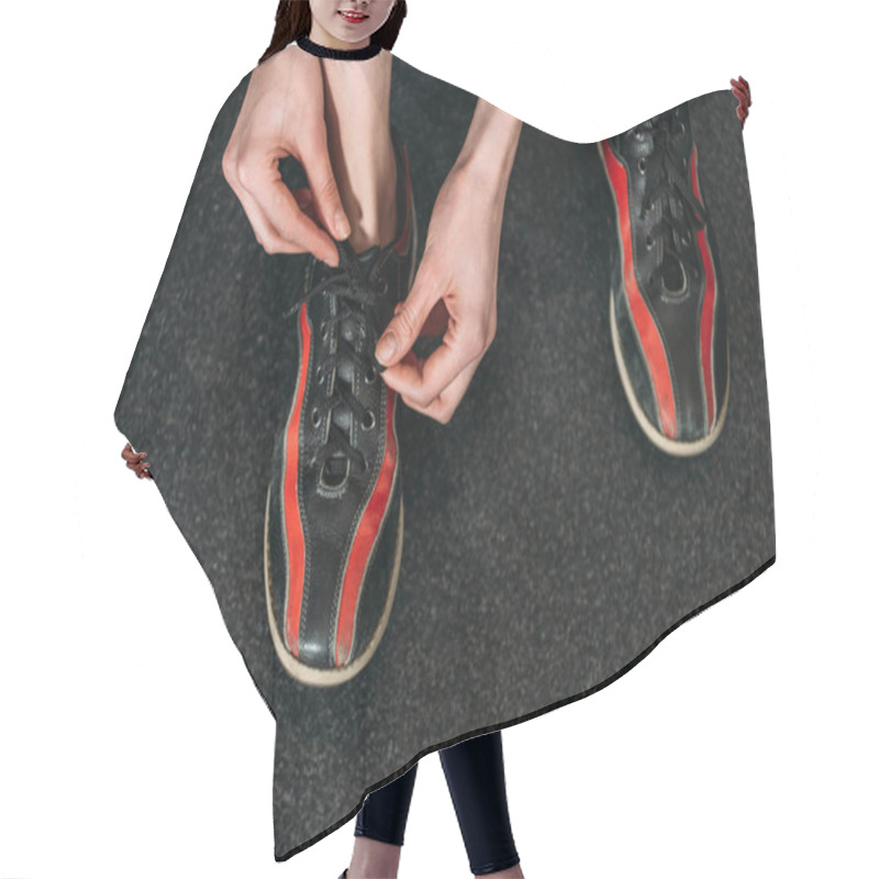 Personality  Cropped Shot Of Woman Tying Up Rental Bowling Shoes Hair Cutting Cape