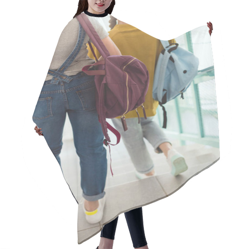 Personality  Cropped Shot Of Schoolgirls With Backpacks Walking Down Stairs At School Corridor Hair Cutting Cape