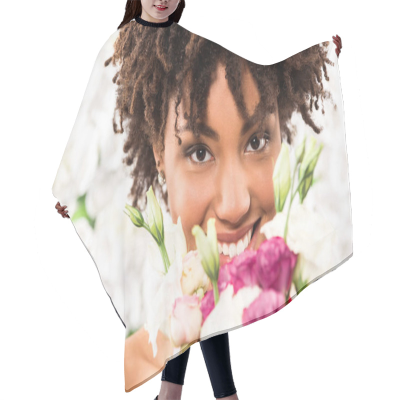 Personality  Selective Focus Of Cheerful African American Bride Looking At Camera While Holding Flowers  Hair Cutting Cape