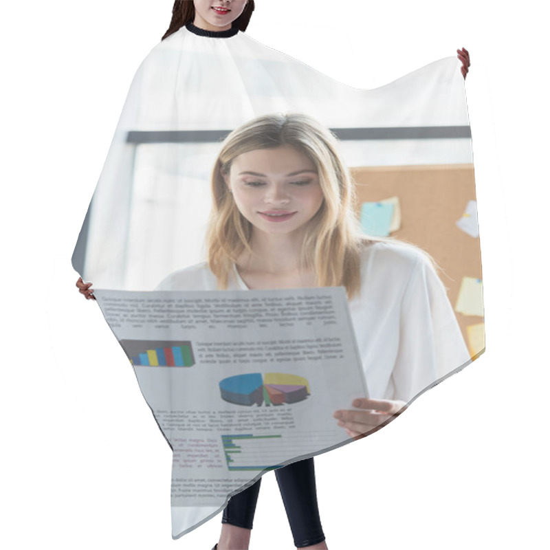 Personality  Smiling Businesswoman Holding Document With Graphs In Office  Hair Cutting Cape