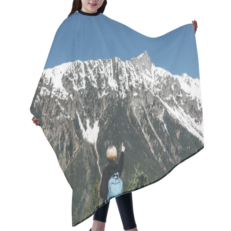 Personality  Back View Of Young Woman With Backpack Pointing With Finger At Majestic Snow-capped Mountains, Mont Blanc, Alps Hair Cutting Cape