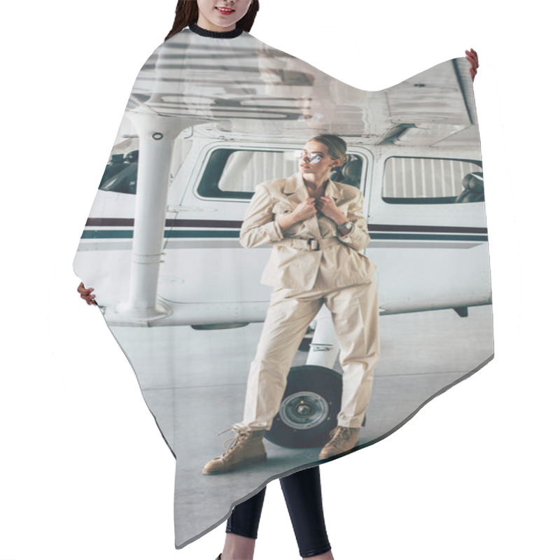 Personality  Attractive Stylish Woman In Sunglasses And Jacket Posing Near Aircraft In Hangar Hair Cutting Cape