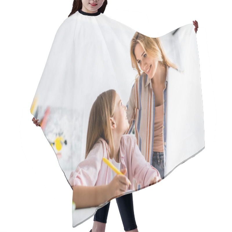 Personality  Selective Focus Of Smiling Kid Looking At Mother During Online Education At Home  Hair Cutting Cape