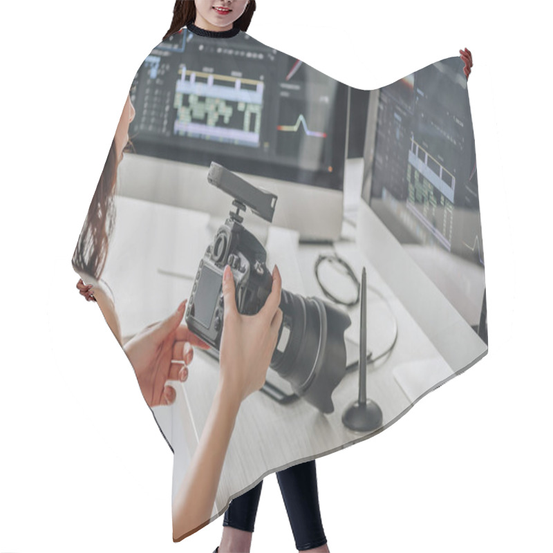 Personality  Art Editor Holding Digital Camera Near Table With Computer Monitors  Hair Cutting Cape