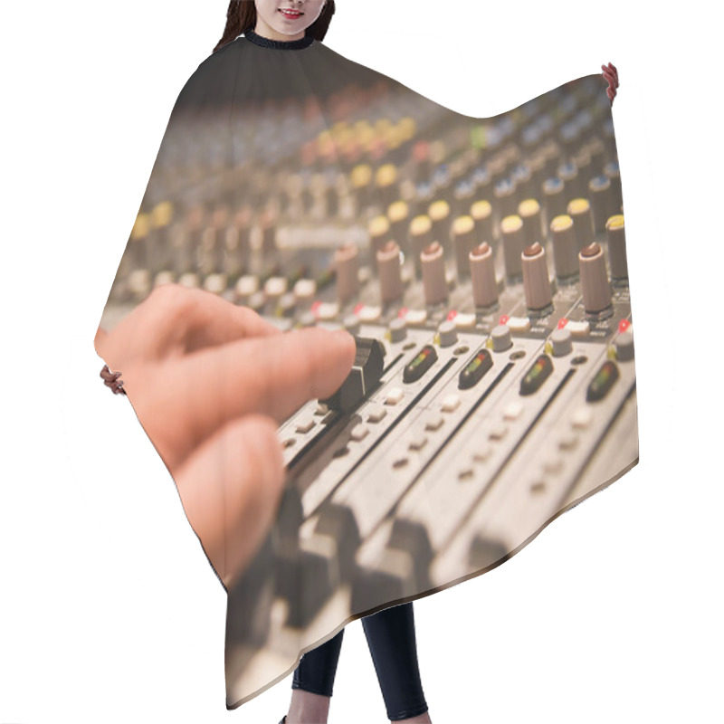 Personality  Close-up Hands Of Sound Engineer Adjusting Audio Mixer Controller For Live Music And Studio Equipment. This Is A Quality Audio System For Professionals. Vintage Tone & Effect Light In Control Room. Hair Cutting Cape