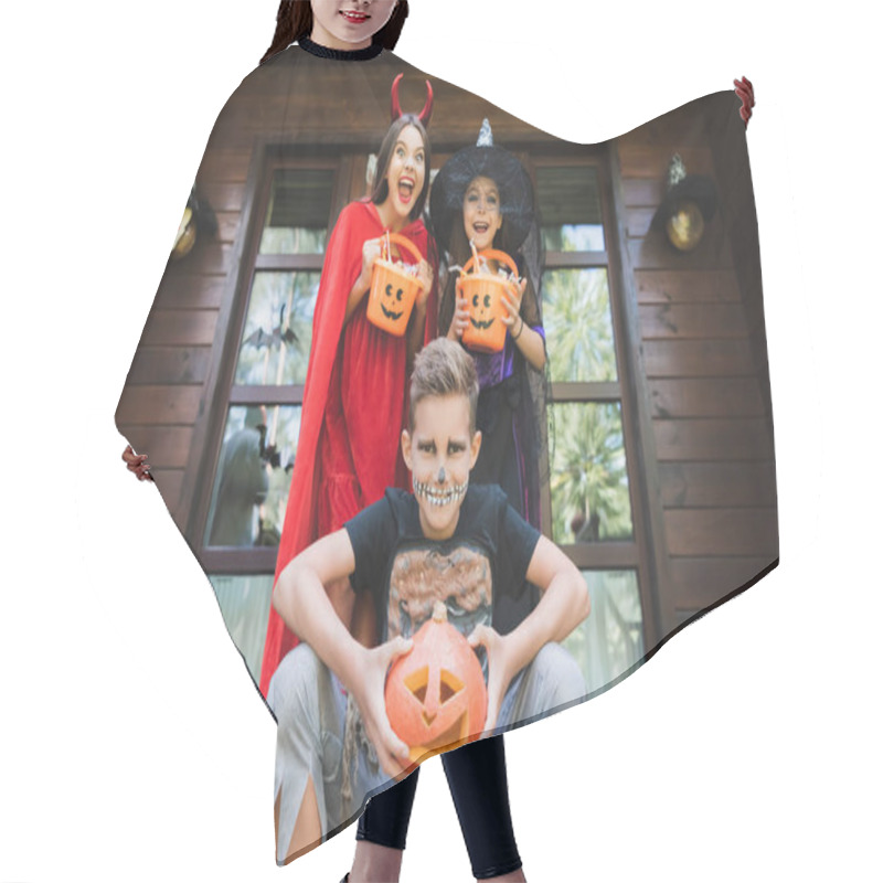 Personality  Cheerful Siblings In Halloween Costumes, With Carved Pumpkin And Buckets With Candies On Cottage Porch Hair Cutting Cape