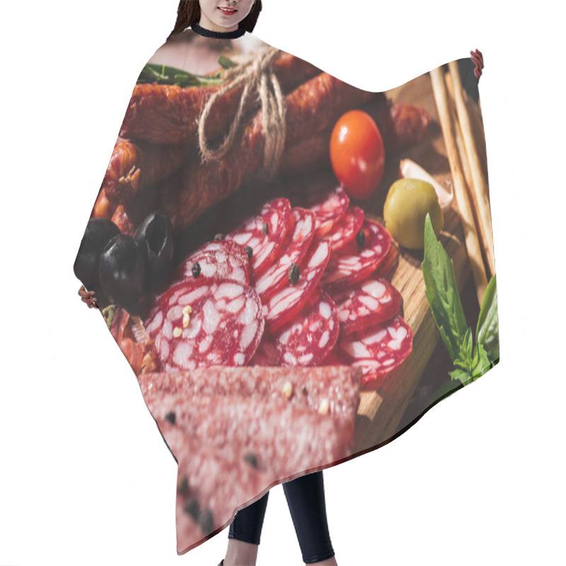 Personality  Close Up View Of Delicious Smoked Sausages And Sliced Salami With Vegetables On Wooden Cutting Board Hair Cutting Cape