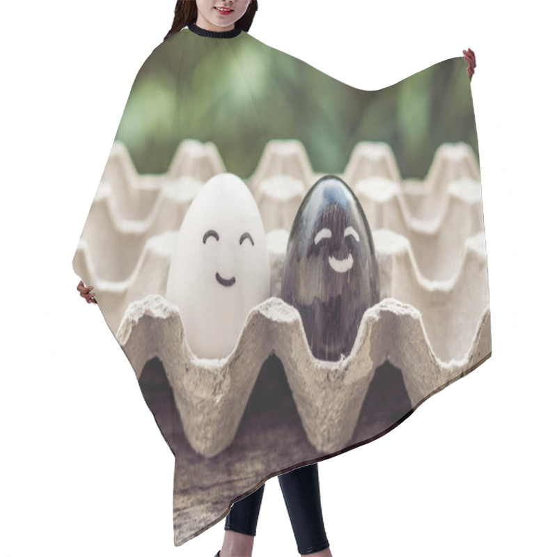 Personality  Interracial Marriage Concept. Black And White Egg As A Pair Of D Hair Cutting Cape