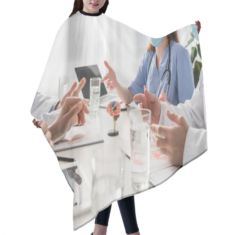 Personality  Doctors And Nurses In Medical Masks Talking While Sitting At Workplace With Devices, Pictures And Glasses Of Water On Blurred Foreground Hair Cutting Cape